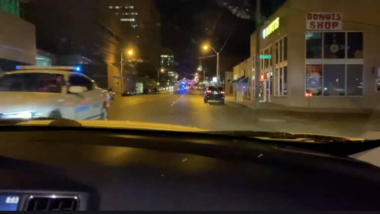 Cars driving in downtown Memphis at night
