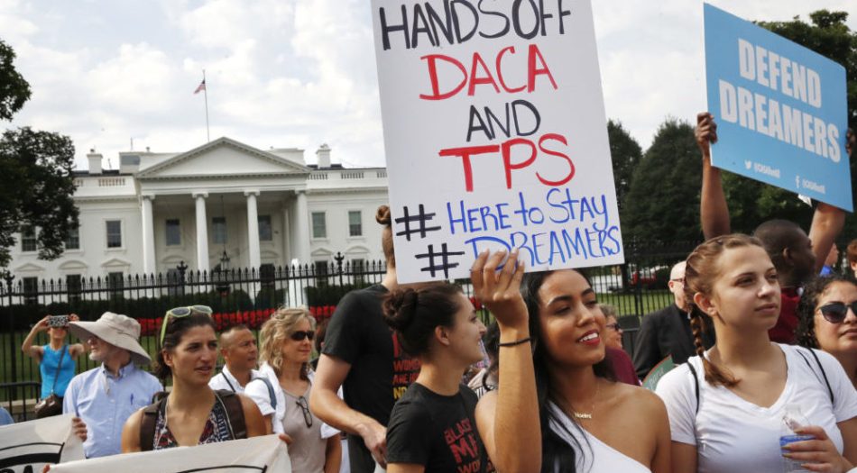 Yurexi Quinones, 24, of Manassas, Va., a college student who is studying social work and a recipient of Deferred Action for Childhood Arrivals, known as DACA, rallies next to Ana Rice, 18, of Manassas, Va., far right, in support of DACA, outside of the White House in Washington, Tuesday, Sept. 5, 2017. President Donald Trump plans to end a program that has protected hundreds of thousands of young immigrants brought into the country illegally as children and call for Congress to find a legislative solution. (AP Photo/Jacquelyn Martin)